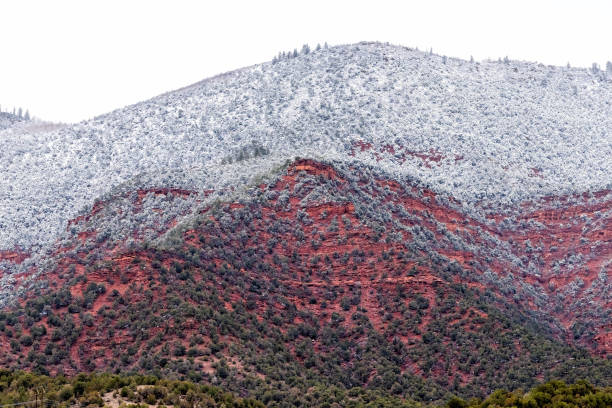 Eagle, Colorado in Eagle county with red canyon cliff mountain on cloudy day landscape covered in winter snow