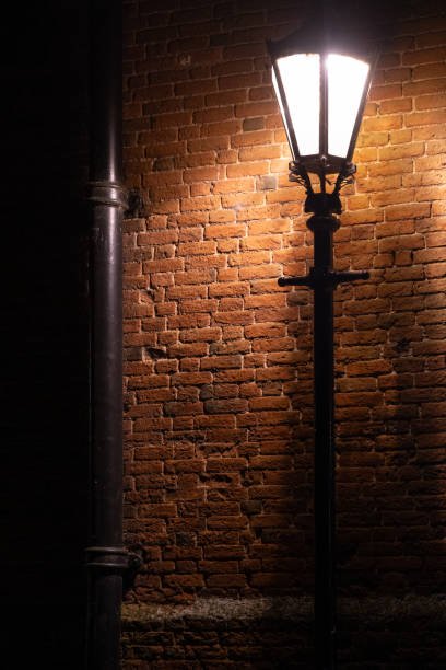 A narrow street between brick buildings in a city