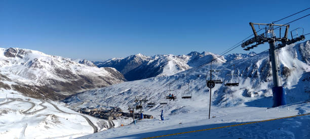 istock Chair lift leading to a ski resort 2198015016