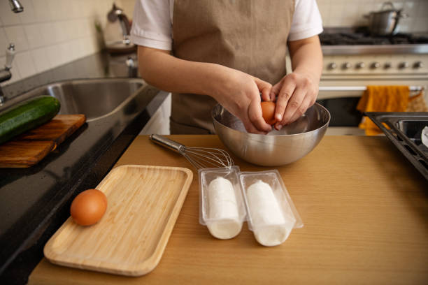 istock Unknown female hands making a savoury pastry dish at home 2198015095