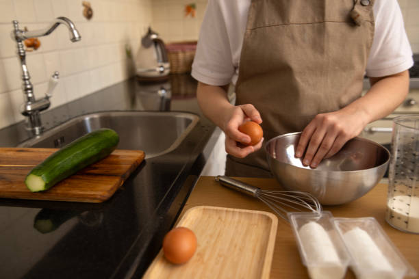 istock Unknown female hands making a savoury pastry dish at home 2198015106