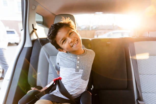 istock Happy Child in Car Seat, Smiling and Looking at Camera 2198015244