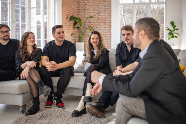 istock Smiling adults enjoy lively conversation in a cozy indoor setting with modern decor and natural light 2198018173