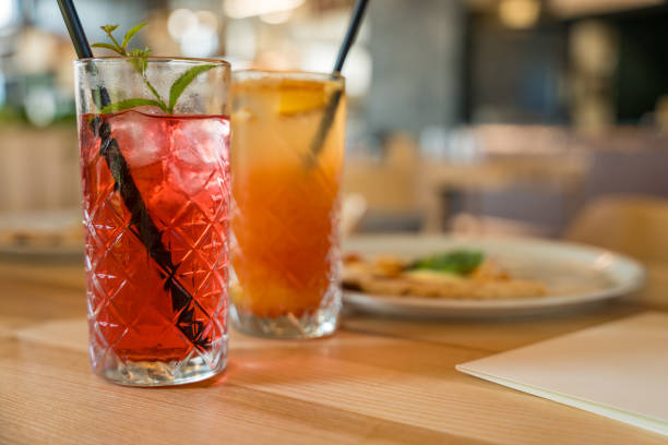 istock Two mocktails, Cinderella with grenadine and raspberry lemonade, on a wooden table in soft focus 2198019507