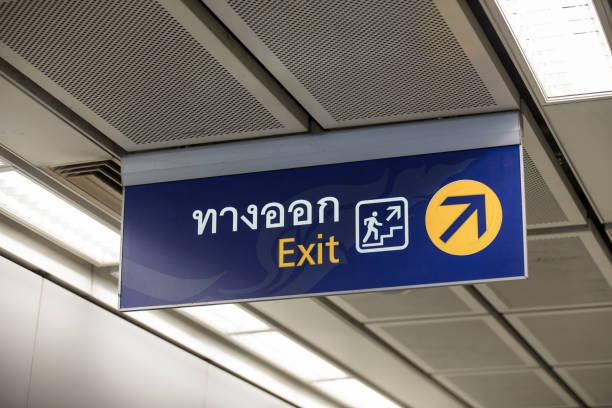 istock MRT subway train station platform Public Transportation Exit Sign in Thai and English 2198023411
