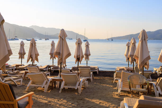 Sun loungers on the beach. Background with selective focus and copy space for text.