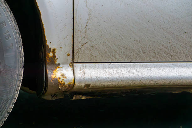 istock rusty door sill at the front of a silver car. rust on car bodywork. rust spots due to age. 2198027671