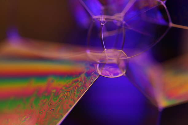 istock Green multicoloured liquid textures, colourful abstract, surrealistic art, line of light, black background, beautiful science 2198028061