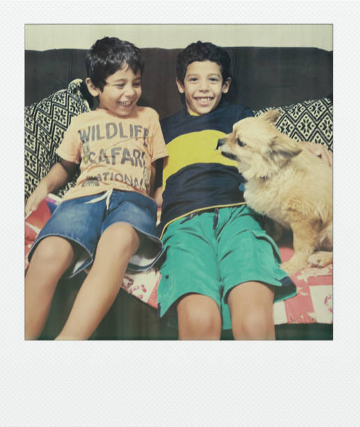istock Children playing with the dog 2198029102