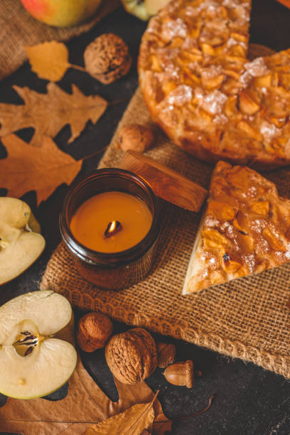 istock Candle and homemade apple pie, autumn mood 2198029982