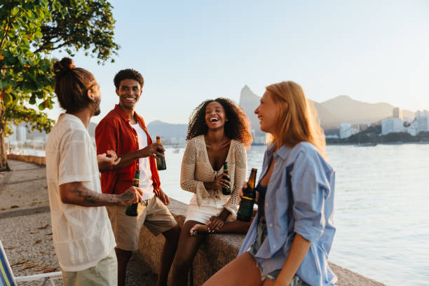 Sports fans watching a match and celebrating at a bar rooftop