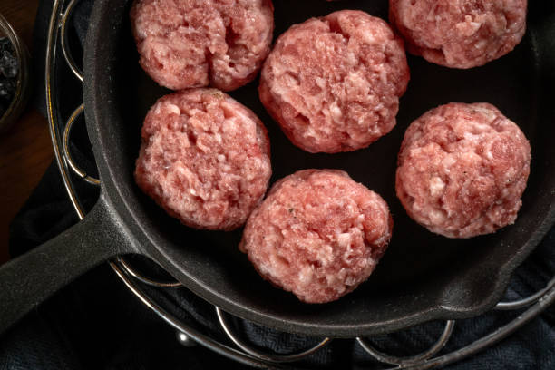istock Fresh raw pork meatballs with spices. 2198039821