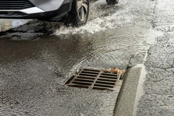 istock Infrastructure Failure of Burst Public Water Main With Urban Flooding Flowing on Road Causing Transport Disruption 2198042741