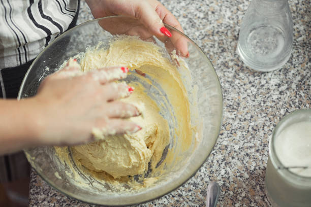 istock Woman preparing donuts in the kitchen 2198049468