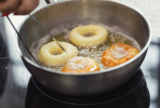 istock Woman preparing donuts in the kitchen 2198049492
