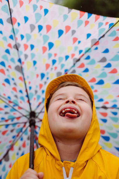 istock Joyful Rain: A Child's Delight in the Little Moments 2198049848