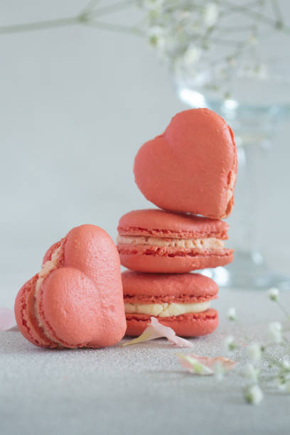 istock French pink heart shaped macaroons on a light backgroundperfect for St Valentines day 2198051215