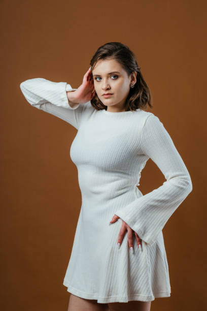 istock A stylish and elegant young woman poses gracefully in a studio setting 2198058400