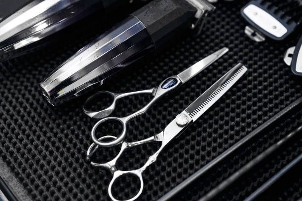 istock Essential tools for barbers in a well-organized grooming kit on black mat 2198058548