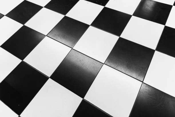 istock Black and white checkerboard floor with clean tiles and shiny surface 2198058592