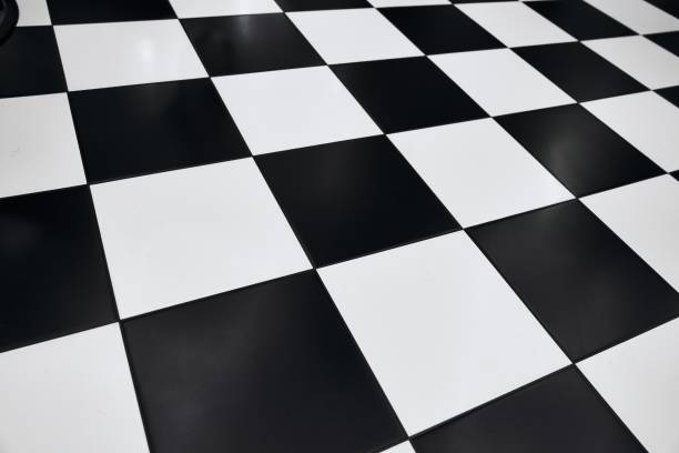 istock Checkerboard floor pattern in a modern indoor space with contrasting tiles 2198059739
