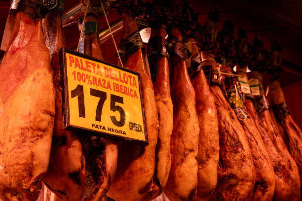 Barcelona, Spain - December 29, 2023. Iberico Bellota ham for sale at Market in Barcelona (Mercat de la Boqueria), Barcelona, Spain