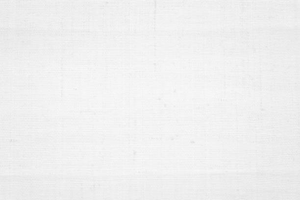 istock White color fabric canvas woven texture background in pattern light blank. Natural gauze linen, carpet wool and cotton cloth textile textured as clean empty for decoration text. Grey sack material. 2198064528