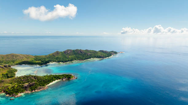 istock Green island surrounded by calm turquoise waters. Curieuse, Seychelles. 2198066972