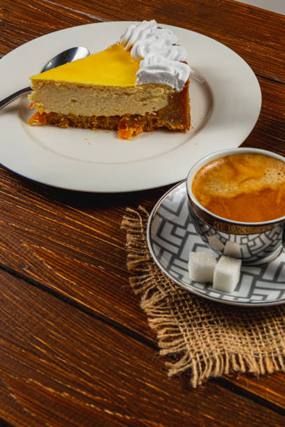 istock Delightful orange cheesecake paired with a rich espresso coffee experience 2198067029