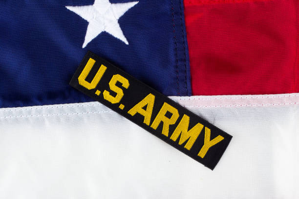 US ARMY Branch Tape on national US flag US ARMY Branch Tape on national US flag background combat infantry badge stock pictures, royalty-free photos & images