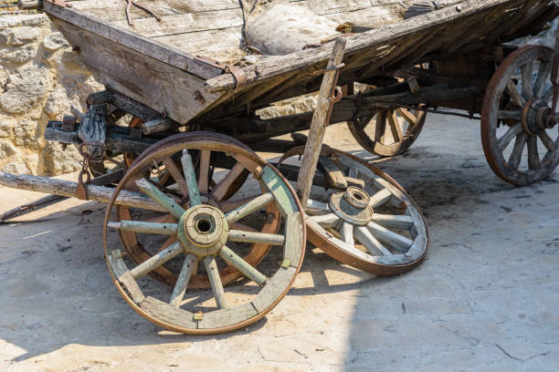 istock Old broken wooden carriage at the farm 2198074655