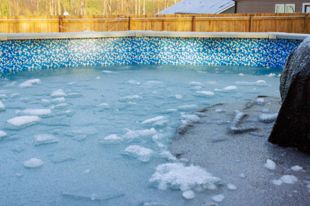 istock Frozen pool with ice and bubbles under bright sunlight during a chilly winter morning 2198078238