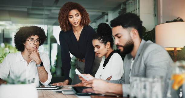 istock App development, laptop and project management with business people in office for web design discussion. Collaboration, documents and meeting with employee team in workplace for planning or strategy 2198078589