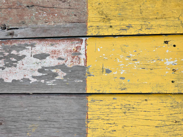 istock Wall of partial yellow colour wood texture background surface with old natural pattern. 2198082514