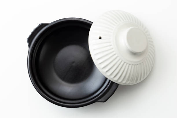 A clay pot commonly used in Japan on a white background.