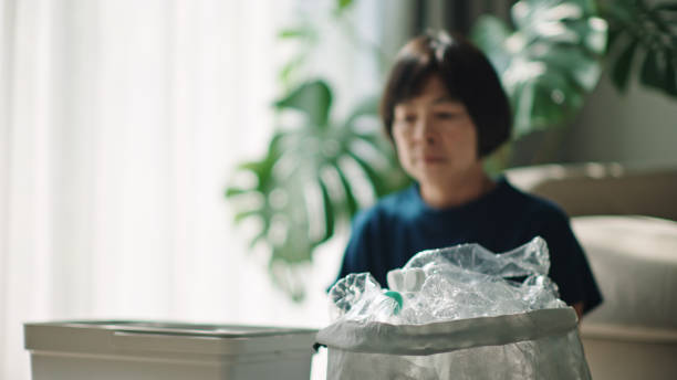 istock Woman separating waste plastic bottle. 2198089765