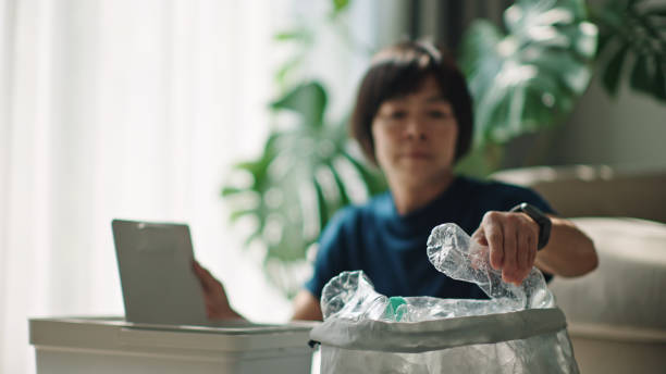 istock Woman separating waste plastic bottle. 2198089769