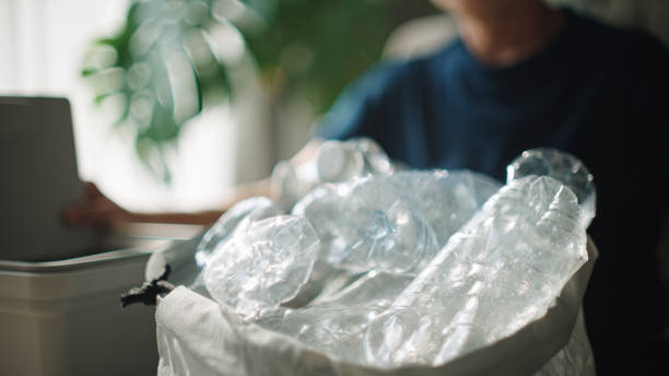 istock Woman separating waste plastic bottle. 2198089770