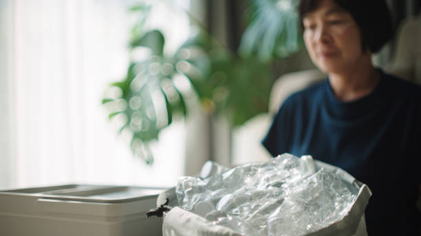 istock Woman separating waste plastic bottle. 2198089772
