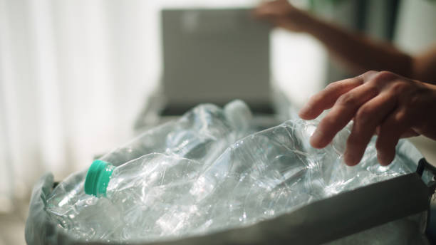 istock Woman separating waste plastic bottle. 2198089777