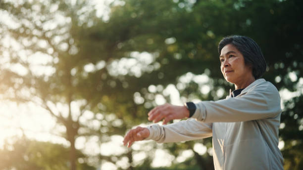 istock Senior woman relax exercise at park. 2198092831