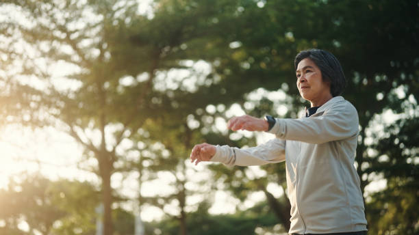 istock Senior woman relax exercise at park. 2198092852