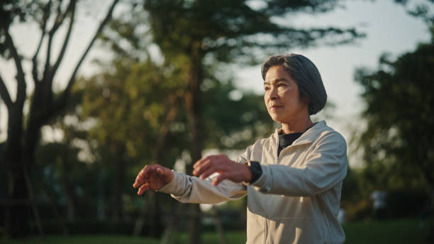 istock Senior woman relax exercise at park. 2198092861