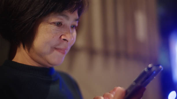 istock Mature woman using smartphone. 2198093156