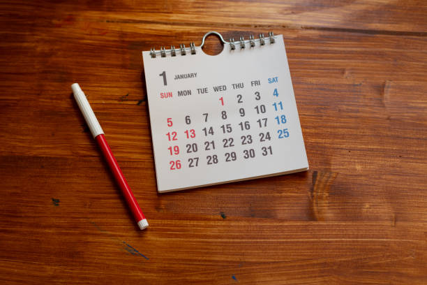 istock Desk calendar on wood background 2198094151
