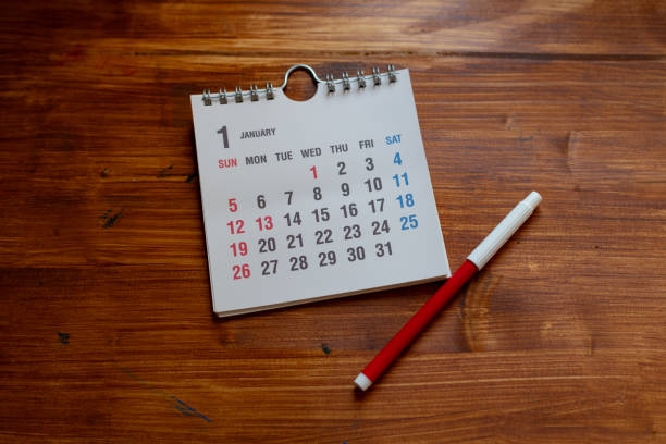 istock Desk calendar on wood background 2198094155