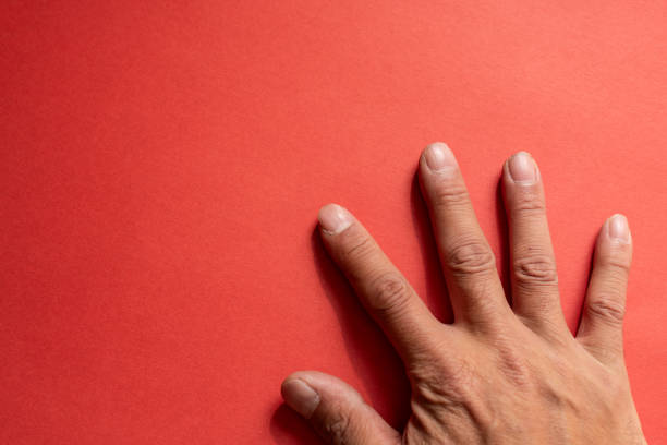 istock Male hand on a red background 2198094222