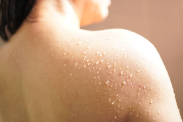 Close-up Water drops on the shoulder of a woman taking a shower