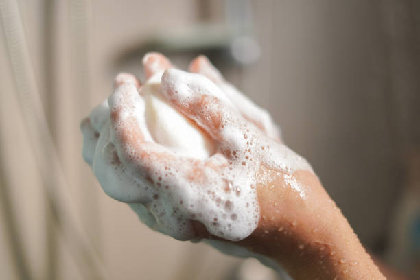 istock Woman rubs soap in her hands until it foams. 2198096388