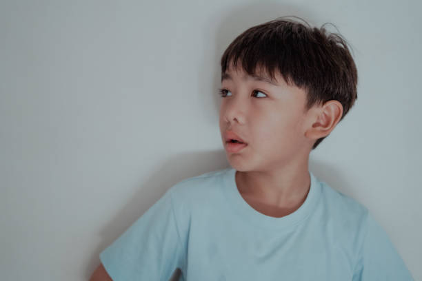 Close-up Boy face is worried and feels sad.